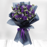 Purple Lisianthus/Eustoma flowers wrapped in black color.